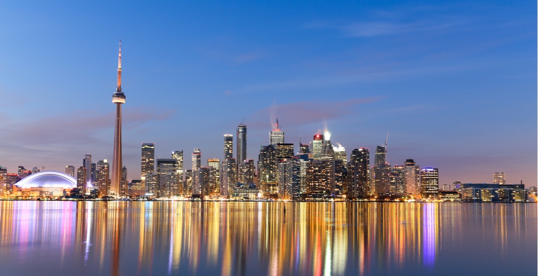 Toronto skyline at dusk, viewed from across Lake Ontario – perfect for luxury travel advisors seeking a top host agency in Canada