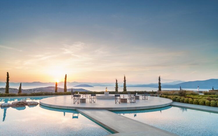 pool and colonnade at Amanzoe in Greece where an Aman Travel Advisor can book this for you