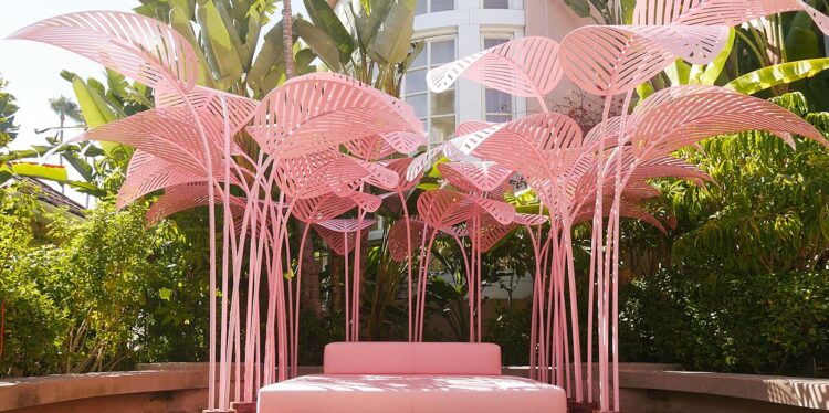 Pink palm leaf art installation and lounge at The Beverly Hills Hotel in Los Angeles