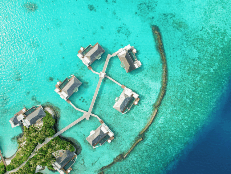 Cheval Blanc Randheli, one of the best hotels in Maldives, featuring private overwater villas in turquoise lagoon waters