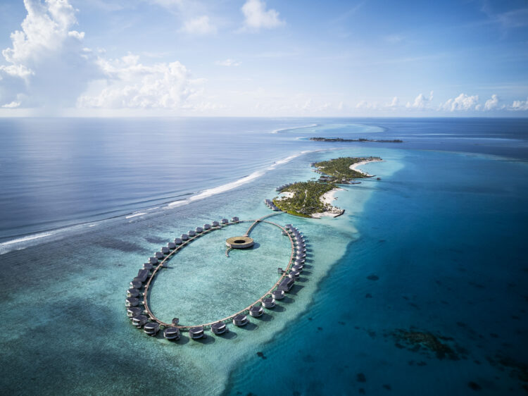 The Ritz-Carlton Maldives Fari Islands, one of the best hotels in Maldives, featuring luxury overwater villas in a stunning circular design