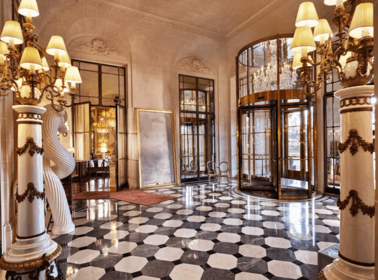 Le Meurice Paris Deals – elegant hotel lobby with marble floors and grand revolving doors