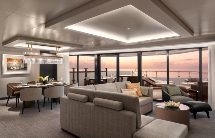 Ultra-luxury cruise suite with oceanfront balcony at sunset on Ritz-Carlton Yacht Collection
