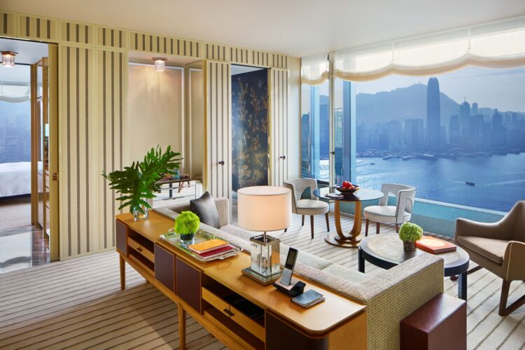 Rosewood Hong Kong luxury suite with panoramic views of Victoria Harbour skyline