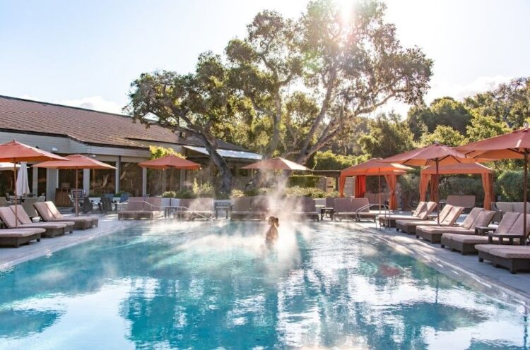 Carmel Valley Ranch California heated pool surrounded by oak trees — luxury family vacation with teens