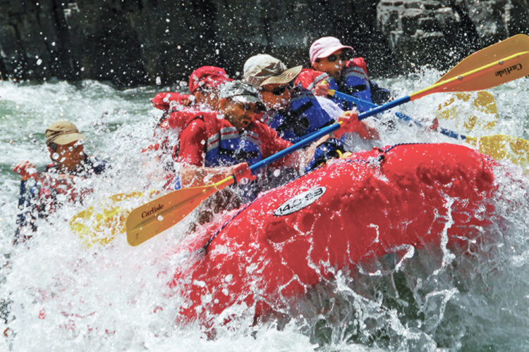 Family whitewater rafting adventure near Four Seasons Jackson Hole during a luxury family holiday in Wyoming