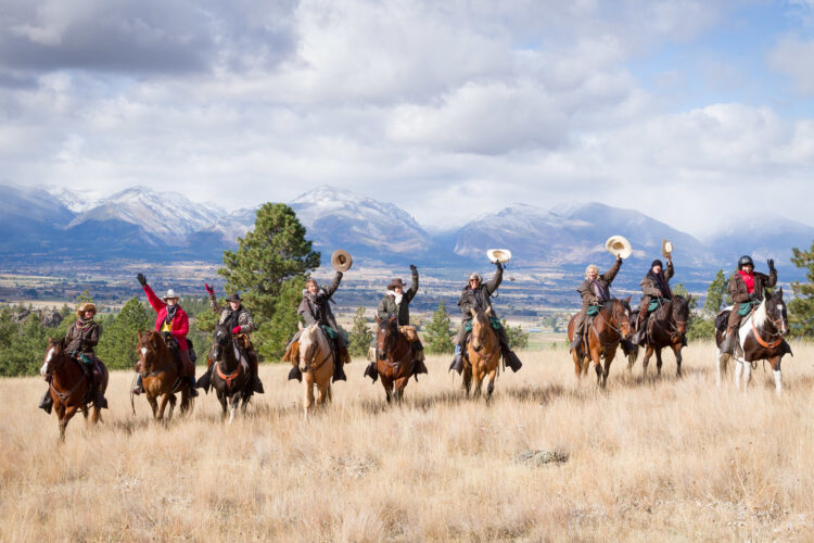 Family horseback riding adventure at Triple Creek Ranch in Montana during a luxury family holiday