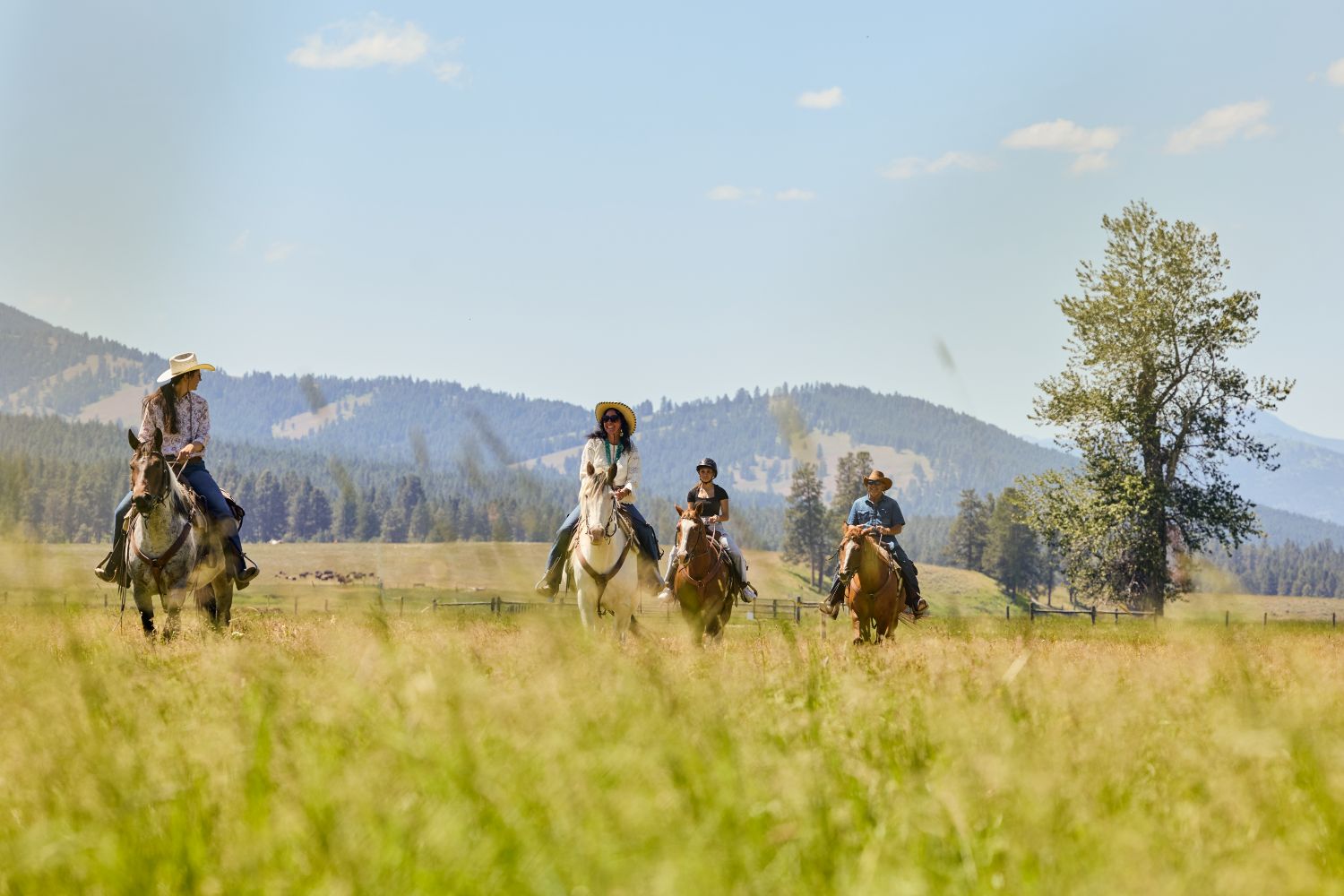 Luxury horseback riding experience at The Resort at Paws Up in Montana during summer