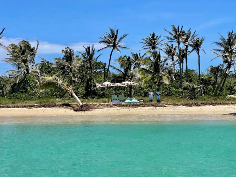 Private island setup with umbrellas and loungers in Madagascar