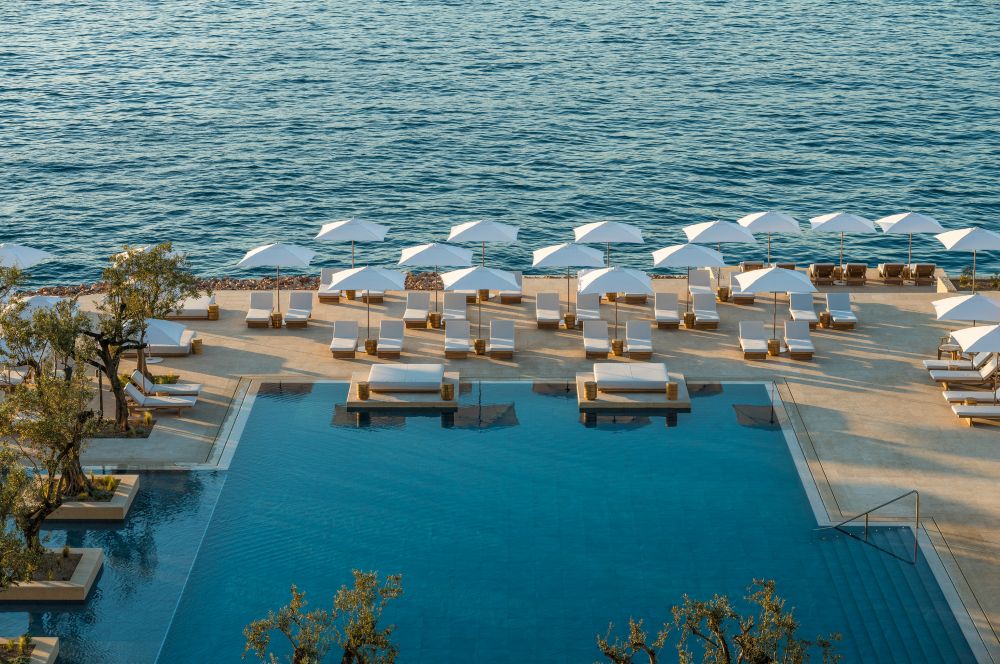 Luxury Mediterranean resort in July at Four Seasons Astir Palace Athens with pool and seaside views