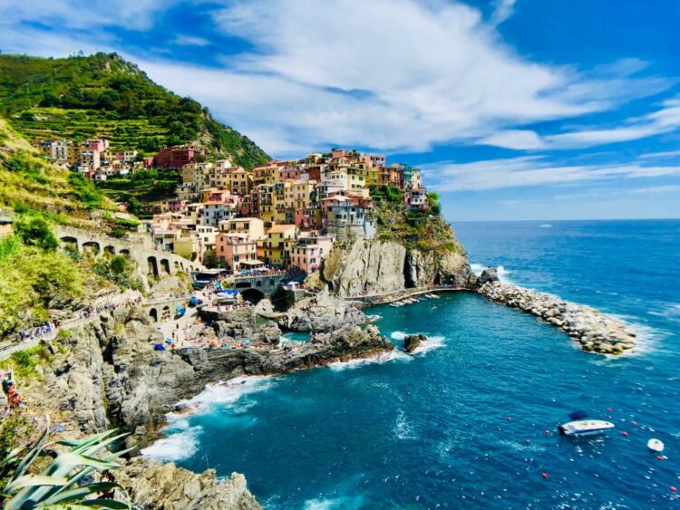 Luxury travel in June on Italy’s Amalfi Coast with coastal villages and clear blue water