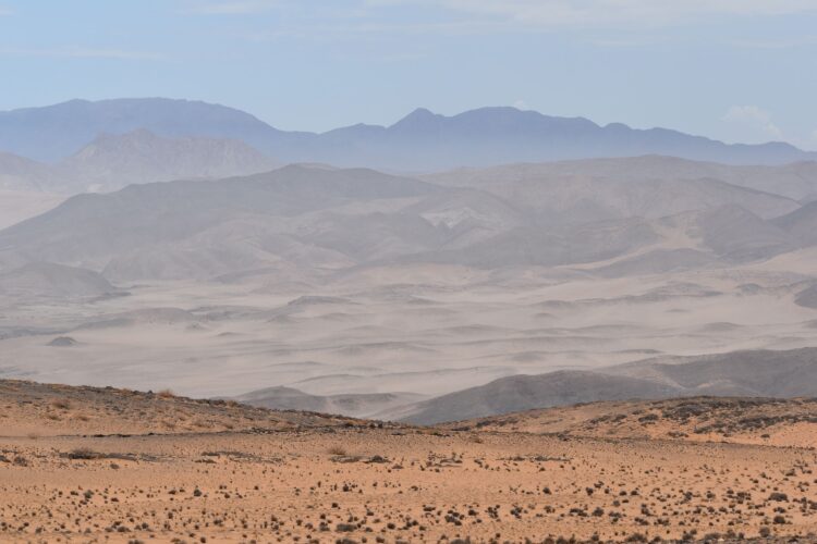Luxury Namibia safari landscape with dramatic desert mountains and dunes