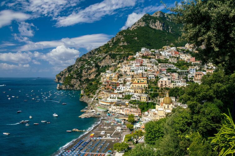 Positano cliffside, beach, and boats on the Amalfi Coast in September