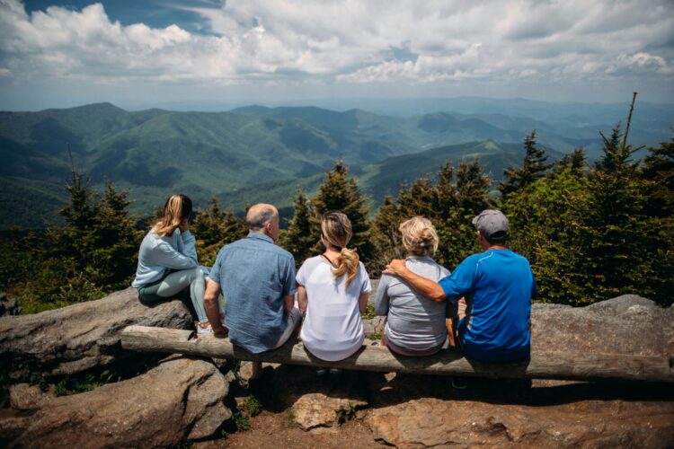 Multi-generational family gathering together to celebrate an unforgettable 80th birthday trip